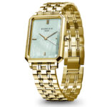 nska ura ROSEFIELD OGGSG-O71 s strani – zlato kvadratno ohišje in turkizno zelena številčnica.